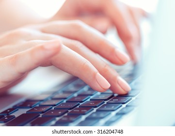 Female hands or woman office worker typing on the keyboard - Shutterstock ID 316204748