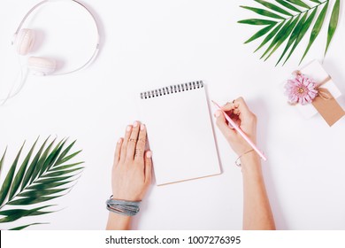 Female Hands Write In A Notebook At The Desk, Top View