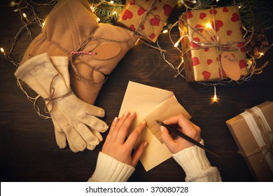 Female Hands Writing Christmas Greeting Letter