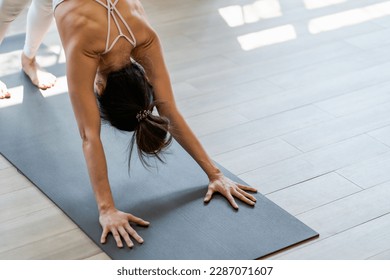 Female happiness Attractive young asian woman doing yoga stretching exercise on mat yoga  fitness exercises. Healthy lifestyle Calmness and relax at home