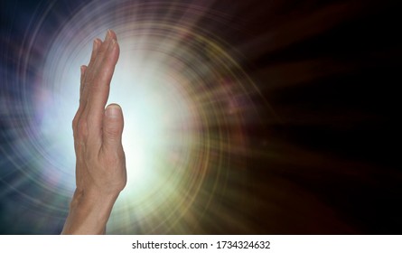 Female Healer With Powerful Palm Chakra Energy -  Upright Open Hand Facing Out With A Spiral Vortex Energy Radiating Against A Warm Brown  Background With Copy Space On Right
