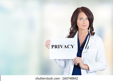 Female Healthcare Professional Doctor Scientist Researcher Pharmacist Holding Privacy Sign Isolated Hospital Windows Background. Confidentiality Patient Care Medical Record Information HIPAA Concept
