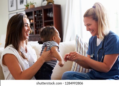 Female healthcare worker visiting a young mum and her infant son at home