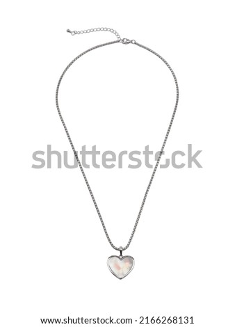 Female heart shaped pendant with silver chain necklace isolated on white. Top view 
