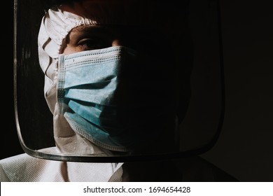 Female Hero Doctor With Mask And Face Shield Crying Tear Due To Coronavirus Covid-19 Situation 