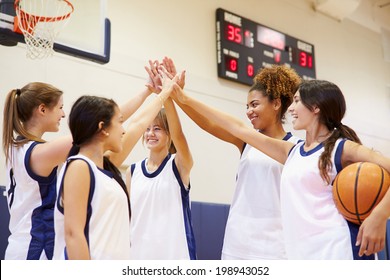 Female High School Basketball Team Having Team Talk - Powered by Shutterstock