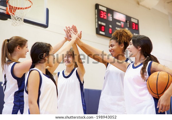 Female High\
School Basketball Team Having Team\
Talk