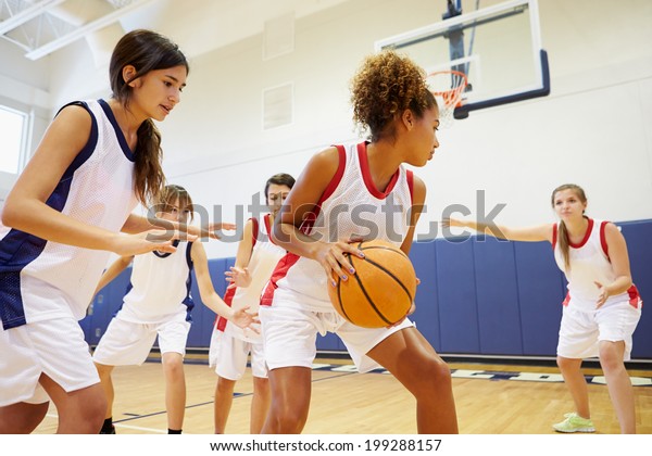 Female High\
School Basketball Team Playing\
Game