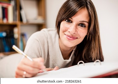 Female high school student making notes