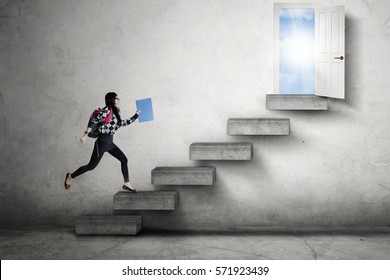 Female high school student running on the stairs leads to an opportunity to success