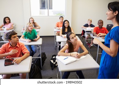 Female High School Teacher Taking Class