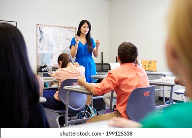 Female High School Teacher Taking Class