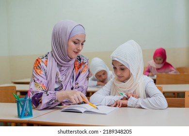 Female Hijab Muslim Teacher Helps School Stock Photo 2189348205 ...