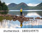 Female hiker and dog at Jordan Pond and The Bubbles, Acadia National Park, Maine