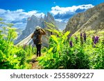 Female hiker enjoying the breathtaking view of the odle mountains on seceda during a sunny summer day, italian alps