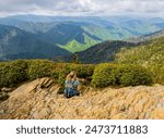 Female Hiker Enjoying View From Cliff Top Viewpoint on Mt. LeConte, Great Smoky Mountains National Park, Tennessee, USA