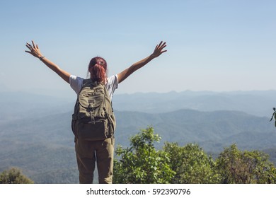 Female Hiker, Holding Hiking Stick In Air, Smiling