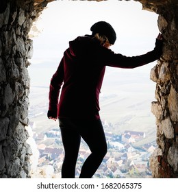 A Female Hiker, Looking Down From A Hole Inside Of A Castle, In Brno, Czechia In Winter Of 2020.