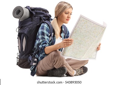 Female Hiker Sitting On The Floor And Looking At A Generic Map Isolated On White Background