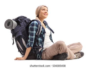 Female Hiker Sitting On The Ground And Looking Up Isolated On White Background