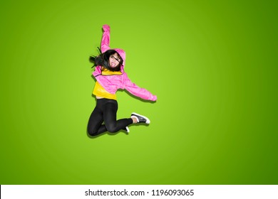 Female Hip-hop Dancer Jumping And Dancing In The Studio With Green Screen Background