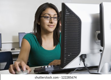 Female Hispanic student using computer in lab