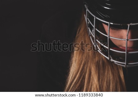 Female hockey player close up helmet and mask