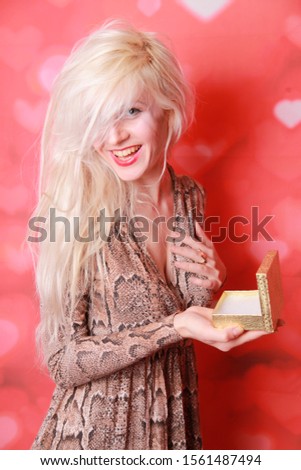 Young happy woman holding an envelope