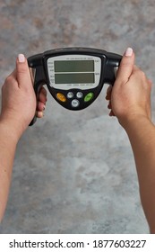 A Female Holding A Fat Loss Monitor A Grunge Background