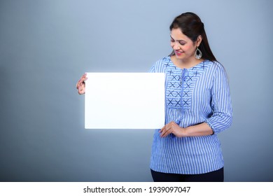 Female holding a message board 