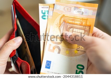Similar – Image, Stock Photo Woman holding colorful wallets against yellow background