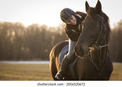 Female horse rider riding outdoors on her lovely horse - Powered by Shutterstock