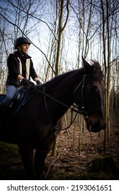 Female Horse Rider Riding Outdoors On Her Lovely Horse