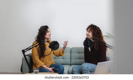 Female Host Recording Radio Podcast Interview With Guest At Home Office - Main Focus On Right Latin Woman Face