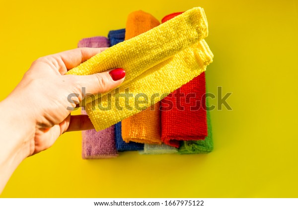 Female\
housekeeper holding a cleaning dry microfiber cloth.Cleaning or\
housekeeping concept background. Spring general or regular clean\
up. Commercial cleaning company concept.Copy\
space