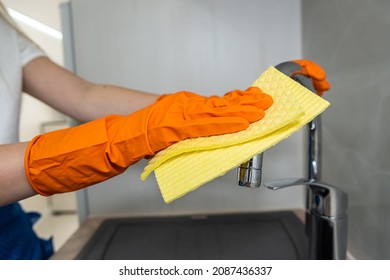 Female Housekeeping Hands In Gloves Cleaning Counter Top In Kitchen, Close Up. Cleaning Concept