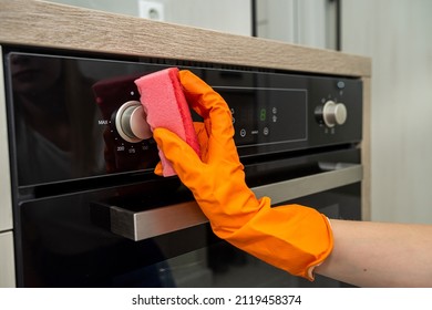 Female Housekeeping Hands In Gloves Cleaning Counter Top In Kitchen, Close Up. Cleaning Concept