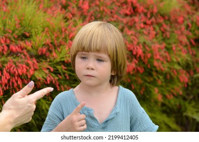 Female Index Finger. A Little Boy Listens To His Mother's Instructions Angry Mother Is Scolding At Her Son. Family Conflict Concept