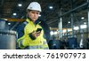 factory worker on phone