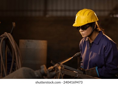 
Female industrial worker working with blow torch in factory - Powered by Shutterstock