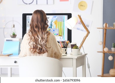 Female interior designer working in office