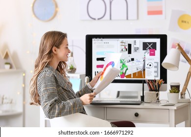Female Interior Designer Working In Office