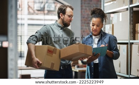 Female Inventory Manager Using Tablet Computer, Talking to a Worker Holding Two Cardboard Packages. They Discuss Customer Orders. Stock of Parcels with Products Ready for Shipment in the Background.