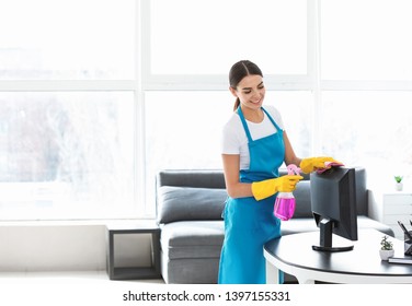 Female Janitor Cleaning The Office