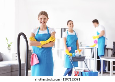 Female Janitor And Her Team In Office