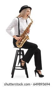 Female Jazz Musician Seated On A Chair Playing A Saxophone Isolated On White Background