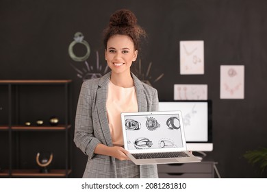 Female jewelry designer working in office - Powered by Shutterstock