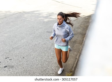 Female jogger running and jogging.Image taken from above. - Powered by Shutterstock