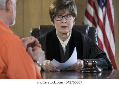 Female Judge Reading A Verdict In A Courtroom