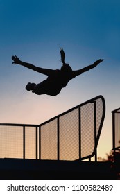 Female Jump From Diving Board In Dusk